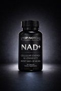 Black supplement bottle labeled 'NAD+' on a dark background